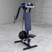 Body-Solid Pec Dec Machine GPM65B in a warehouse setting, featuring dual overhead variable resistance cams, articulating pec arms, and black frame for chest and shoulder workouts.