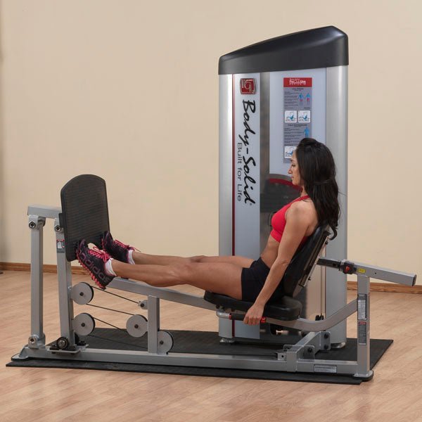 Athlete demonstrating the Body-Solid Pro Clubline Series II S2LPC Leg Press & Calf Raise in fully extended leg position during leg press exercise.