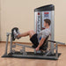 Athlete demonstrating the Body-Solid Pro Clubline Series II S2LPC Leg Press & Calf Raise in starting position with knees at chest, preparing for leg press exercise.