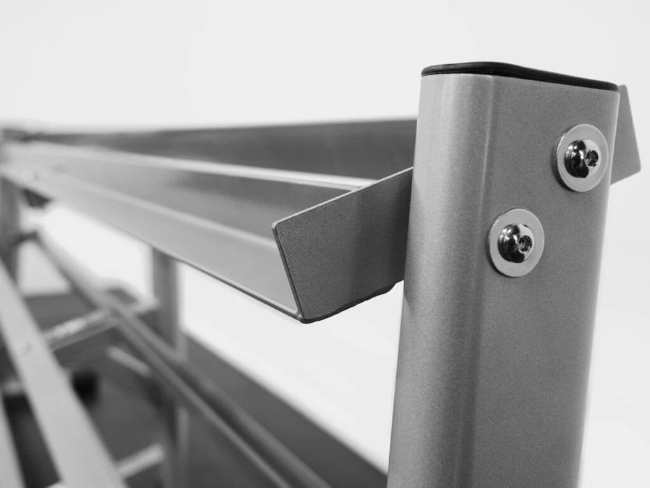 Close-up side view of the BodyKore G243 Dumbbell Rack, highlighting the durable oval-tubed frame and angled design for easy dumbbell access.