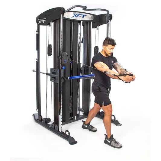 Bodycraft XFT Functional Trainer side with all white background and athlete performing cable exercises