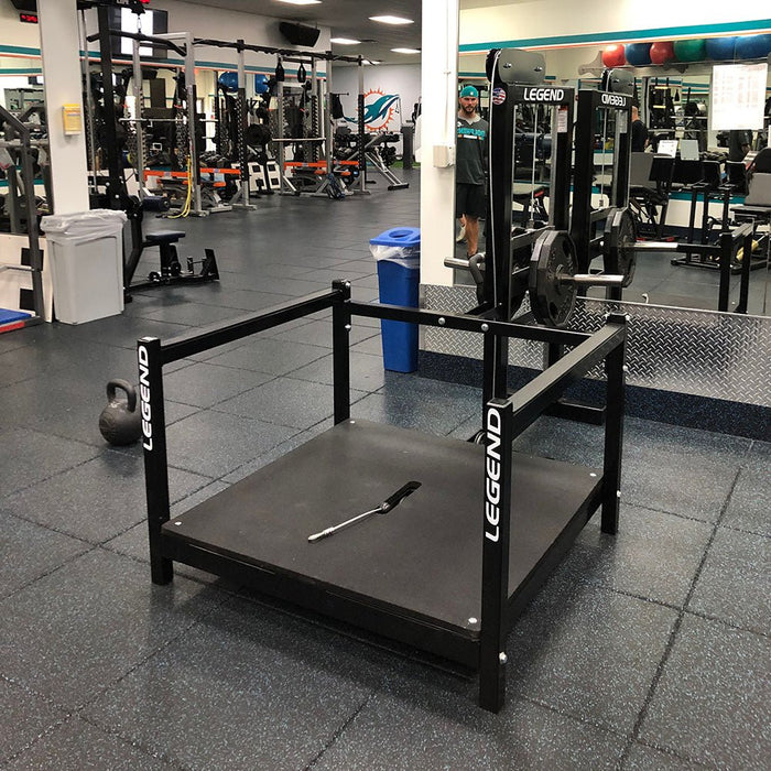 Black Legend Fitness 3217 Belt Squat Machine in the Miami Dolphins NFL weight room, showcasing its sleek design and professional-grade construction, used by elite athletes for comprehensive lower-body training.