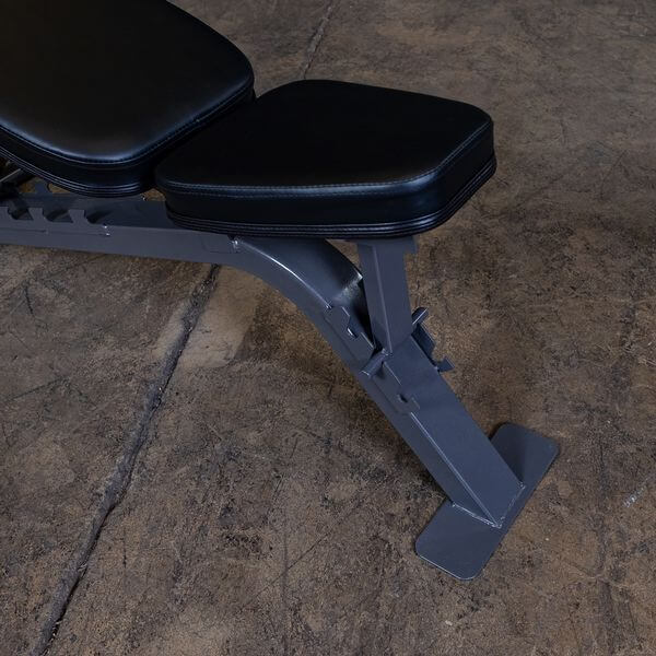 Close-up view of the adjustable seat on a flat/incline bench, showing ladder-style adjustment mechanism.