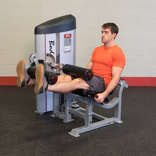 A male athlete performing a leg extension on the Pro Clubline Leg Extension Leg Curl Combo Series II S2LEC, showcasing the machine's ergonomic design and adjustable features for effective quad strengthening.