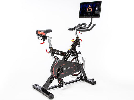 Side view of the SPX-Mag Indoor Cycle with magnetic resistance and adjustable handlebars, set against a white background, designed for home and commercial use.  Also shows Connect-22 tablet