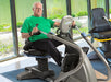 Senior using the NuStep T5 Recumbent Cross Trainer, demonstrating accessibility and comfort with the low step-through design.