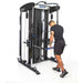 Bodycraft XFT Functional Trainer side with all white background and athlete doing tricep pushdown arm exercises