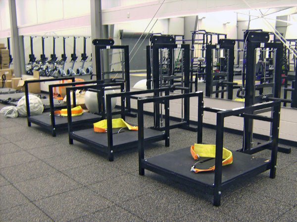 Three Legend Fitness machines in a gym, showcasing their durable construction and versatility, providing high-quality strength training options for various exercises in a professional fitness environment.