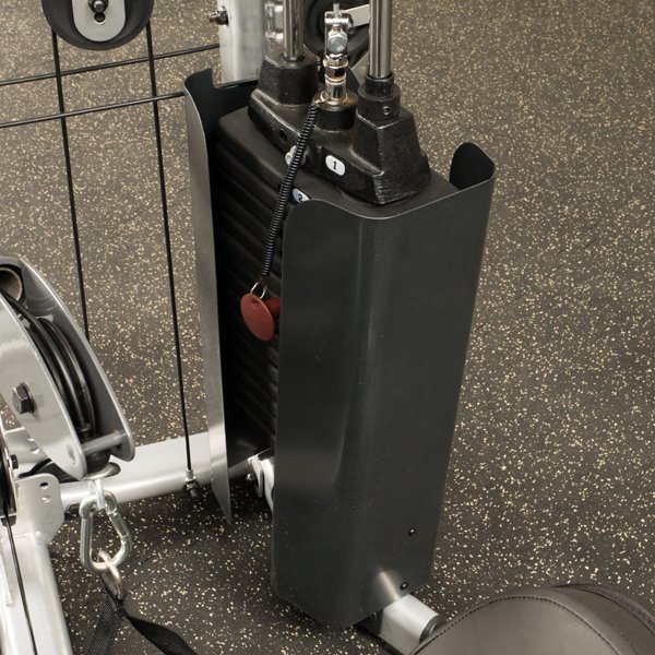 Close-up view of the weight stack with shrouds on the Powerline by Body-Solid P2X Multi-Functional Home Gym, showcasing the compact design and protective features.