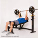 Athlete performing incline bench press on Powertec Workbench Olympic Bench WB-OB20.