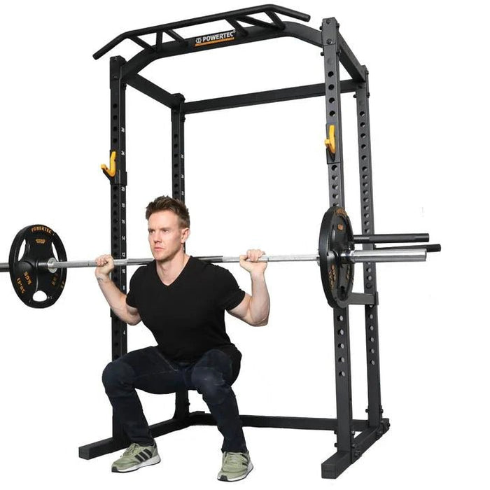 Athlete performing a barbell squat from the side front on the Powertec Workbench Power Rack WB-PR19 Black Frame