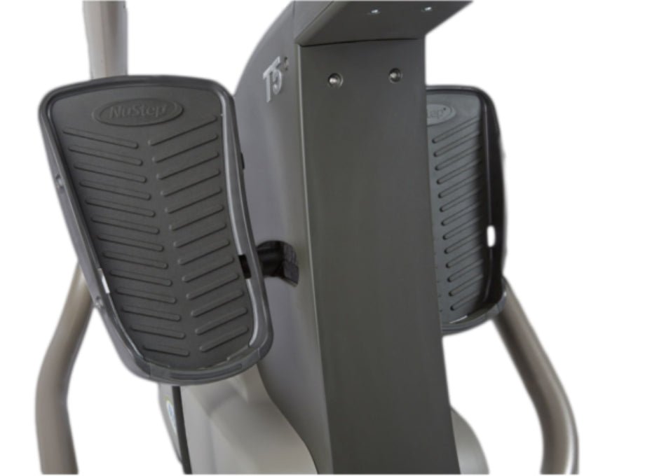 Close-up of the pedals on the NuStep T5 Recumbent Cross Trainer, highlighting the supportive foot placement and smooth stepping motion.