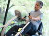 Senior using the NuStep T4r Recumbent Cross Trainer, demonstrating the full-body workout feature.