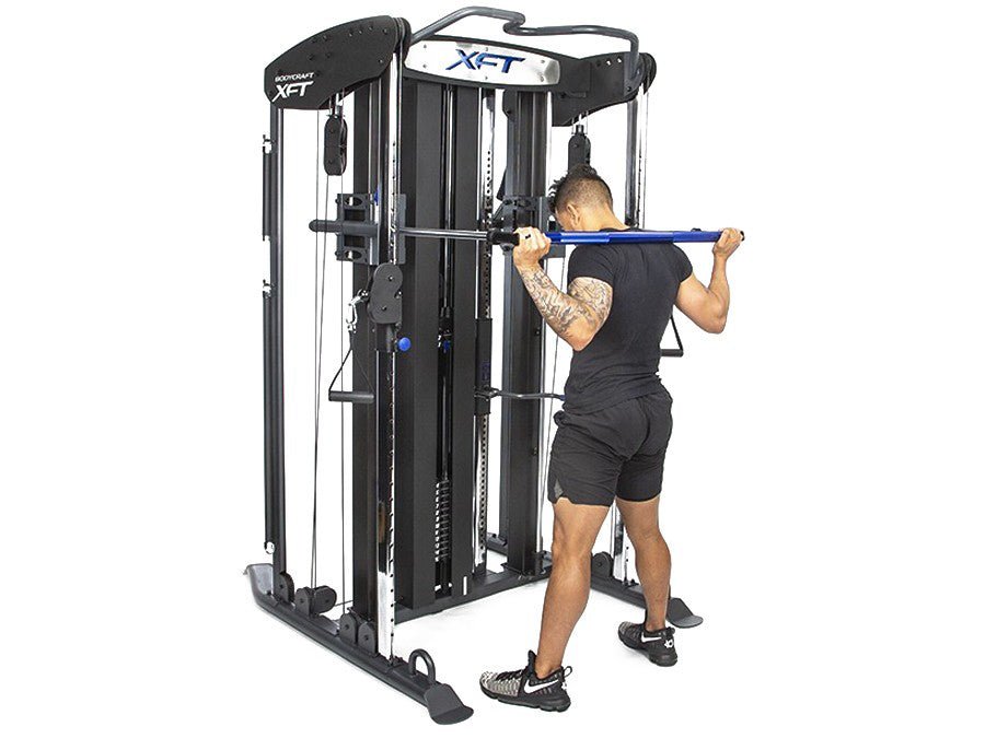 Bodycraft XFT Functional Trainer side with all white background showing athlete about to squat